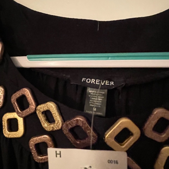 Long black dress, gold detail around neckline 1 is missing but could be fixed. - Picture 1 of 3